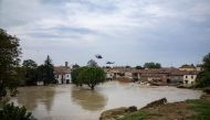 People are evacuated by helicopters of the Italian Air Force during floods in the small village of Traversara, on September 19, 2024. Photo by Federico SCOPPA / AFP