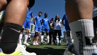 Cameroon refugee Fossi Wandji (C, #99) and his South Korean teammates gather before the men's group stage 4x4 football match between South Korea and Switzerland at the 2024 Homeless World Cup in Seoul on September 24, 2024. Photo by Jung Yeon-je / AFP