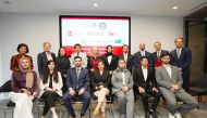 Minister of State for International Cooperation H E Lolwah bint Rashid Al Khater (fifth right, standing) with other participants at the event.