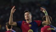 Barcelona's Polish forward #09 Robert Lewandowski celebrates after scoring his team's first goal during the Spanish league football match between FC Barcelona and Getafe CF at the Estadi Olimpic Lluis Companys in Barcelona on September 25, 2024. Photo by LLUIS GENE / AFP.