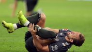 Bayern Munich's English forward #09 Harry Kane reacts injured on the ground during the German first division Bundesliga football match between FC Bayern Munich and Bayer 04 Leverkusen in Munich, southern Germany on September 28, 2024. (Photo by Alexandra BEIER / AFP)