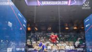 Qatar's Abdulla Al Tamimi (left) in action against England's Adrian Waller during their Q-Terminals Qatar Classic match, yesterday.