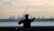 Cranes used for shipping containers rise from the Port of Newark on September 30, 2024 in New York City. (Photo by SPENCER PLATT / GETTY IMAGES NORTH AMERICA / Getty Images via AFP)
