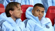 Real Madrid's French forward Kylian Mbappe (R) reacts on the bench during the UEFA Champions League football match between Lille LOSC and Real Madrid at the Pierre Mauroy Stadium in Villeneuve-d'Ascq, northern France, on October 2, 2024 (Photo by FRANCK FIFE / AFP)
