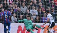 Liverpool's Portuguese striker #20 Diogo Jota (R) shoots past Crystal Palace's English goalkeeper #01 Dean Henderson (C) to score the opening goal of the English Premier League football match between Crystal Palace and Liverpool at Selhurst Park in south London on October 5, 2024. (Photo by Glyn KIRK / AFP)
