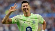 Barcelona's Polish forward #09 Robert Lewandowski celebrates after scoring a hat-trick during the Spanish league football match between Deportivo Alaves and FC Barcelona at the Mendizorroza stadium in Vitoria on October 6, 2024. (Photo by Cesar Manso / AFP)