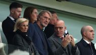 Manchester United's co-owner Jim Ratcliffe (4L) talks with David Brailsford (2R) during the English Premier League football match between Aston Villa and Manchester United at Villa Park in Birmingham, central England on October 6, 2024. (Photo by Adrian Dennis / AFP)
