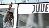 French forward Paul Pogba waves as he arrives to attend the Italian Serie A football match between Juventus and Cagliari at the Allianz stadium in Turin, on October 6, 2024. (Photo by MARCO BERTORELLO / AFP)
