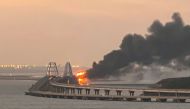 A view shows a fire on the Kerch bridge at sunrise in the Kerch Strait, Crimea, October 8, 2022. File photo for representation purposes only. Reuters/Stringer

