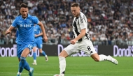 Juventus' Dutch midfielder #8 Teun Koopmeiners (R) fights for the ball with Napoli's Kosovan defender #13 Amir Rrahmani during the Italian Serie A football match Juventus vs Napoli at the Juventus Stadium in Turin on September 21, 2024. Photo by Isabella BONOTTO / AFP