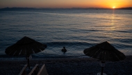 A man swims at Alimos beach in Athens on October 15, 2024. (Photo by Angelos TZORTZINIS / AFP)
