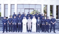 Officials with immigration officers at the conclusion of a training programme. 