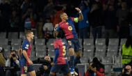 Barcelona's Brazilian forward #11 Raphinha (TOP) celebrates scoring the opening goal during the UEFA Champions League, league phase day 3 football match between FC Barcelona and FC Bayern Munich at the Estadi Olimpic Lluis Companys in Barcelona on October 23, 2024. (Photo by Josep LAGO / AFP)
