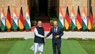 German Chancellor Olaf Scholz (R) shakes hands with India's Prime Minister Narendra Modi before their meeting at the Hyderabad House in New Delhi on October 25, 2024. Photo by Money SHARMA / AFP.