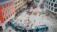 An overall view shows a derailed tram that has driven into a building in a busy street in the center of Oslo, Norway on October 29, 2024. Photo by Terje Pedersen / NTB / AFP