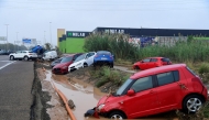 Cars piled due to mudslide following floods are pictured in Picuana, near Valencia, eastern Spain, on October 30, 2024. Floods triggered by torrential rains in Spain's eastern Valencia region has left 51 people dead, rescue services said on October 30. Photo by Jose Jordan / AFP.