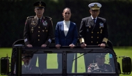 File photo for representational purposes only. Mexico's President Claudia Sheinbaum (C), flanked by Defense Minister Ricardo Trevilla (L) and Secretary of the Navy Raymundo Pedro Morales (R), reviews troops during her inauguration ceremony as the new Supreme Commander of the Mexican Armed Forces at Campo Marte in Mexico City on October 3, 2024. (Photo by Yuri CORTEZ / AFP)

