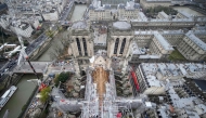 (Files) This photograph taken from atop the Notre-Dame de Paris Cathedral shows the structure of the building during reconstruction work, on the Ile de la Cite in Paris, on December 8, 2023. (Photo by Christophe Ena / POOL / AFP)
 