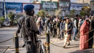 A Somaliand police officer monitors the queues in front of a polling station during the 2024 Somaliland presidential election in Hargeisa on November 13, 2024. Somaliland, a breakaway region of Somalia, holds a presidential election on November 13, 2024 at a time of diplomatic tensions in the Horn of Africa. (Photo by LUIS TATO / AFP)
