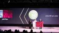 Minister of Education and Higher Education H E Lolwah bint Rashid Al Khater (left) honouring a winner at the conclusion of 4th Arab Mathematics Olympiad 2024 in Doha yesterday.