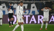 Real Madrid's French forward #09 Kylian Mbappe leaves the pitch after an injury during the UEFA Champions League football match between Atalanta and Real Madrid at the Gewiss Stadium in Bergamo, on December 10, 2024. (Photo by Alberto PIZZOLI / AFP)