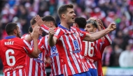 Atletico Madrid's Norwegian forward #09 Alexander Sorloth (R) celebrates after scoring their first goal during the Spanish league football match between Club Atletico de Madrid and Getafe CF at the Metropolitano stadium in Madrid on December 15, 2024. Photo by Pierre-Philippe MARCOU / AFP.