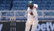 South Africa's Temba Bavuma watches the ball after playing a shot during the third day of the second Test cricket match between South Africa and West Indies at The Wanderers Stadium in Johannesburg on March 10, 2023. (Photo by PHILL MAGAKOE / AFP)