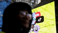 The Tik Tok Logo is displayed on a billboard at Times Square in New York City on January 17, 2025. (Photo by Leonardo Munoz / AFP)
