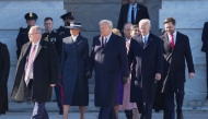 US President Donald Trump, First Lady Melania Trump, outgoing US President Joe Biden and first lady Dr. Jill Biden participate in the departure ceremony for the Bidens on the East Front of the United States Capitol in Washington, DC after the swearing-in of Donald Trump as President on January 20, 2025. (Photo by Chris KLEPONIS / POOL / AFP)
