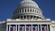 The Capitol is adorned with flags ahead of President-elect Donald Trump's second inauguration. (Photo by Marvin Joseph/The Washington Post)
