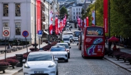 (FILES) Oslo Taxi's Tesla model Y (L) and the NIO ET5 electric vehicle from Nio Inc, a Chinese multinational electric car manufacturer, drive through the Norwegian capital Oslo, on September 27, 2024. (Photo by Jonathan NACKSTRAND / AFP)

