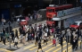 People cross an intersection in the Central business district of Hong Kong on February 27, 2024 on February 28. (Photo by Peter PARKS / AFP)