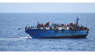 Migrants are seen on a capsizing boat before a rescue operation off the coast of Libya in this photo released by the Italian Marina Militare. (File photo: Reuters).

