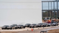 (FILES) Newly manufactured Tesla Cybertrucks are parked outside the company's Giga Texas factory on December 13, 2023, in Austin, Texas. (Photo by SUZANNE CORDEIRO / AFP)
