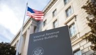A sign for the Internal Revenue Service (IRS) is seen outside its building on February 13, 2025 in Washington, DC. (Photo by Kayla Bartkowski / GETTY IMAGES NORTH AMERICA / Getty Images via AFP)
