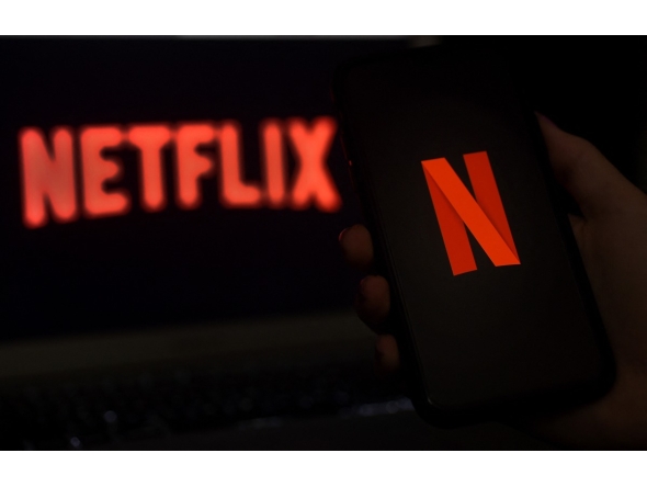 In this photo illustration a computer screen displays the Netflix logo on March 31, 2020 in Arlington, Virginia. Photo by Olivier DOULIERY / AFP