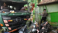 File photo for representational purposes only. Police officers try to move a damaged truck after an accident in Bekasi, on the outskirts of Jakarta, Indonesia, August 31, 2022, in this photo taken by Antara Foto. Antara Foto/Fakhri Hermansyah/ via REUTERS

