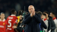 Liverpool's Dutch coach Arne Slot acknowledges the supporters as he celebrates Liverpool's victory at the end of the UEFA Champions League Round of 16 first leg football match between Paris Saint-Germain (FRA) and Liverpool (ENG) at the Parc des Princes stadium in Paris on March 5, 2025. (Photo by GEOFFROY VAN DER HASSELT / AFP)