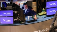 Traders work on the floor of the New York Stock Exchange (NYSE) at the opening bell on March 7, 2025, in New York City. (Photo by Charly Triballeau / AFP)
