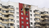 Specialists work on the facade of a damaged apartment building following a drone attack in Moscow on March 11, 2025. Photo by TATYANA MAKEYEVA / AFP.
