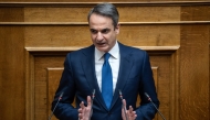 (Files) Greek Prime Minister Kyriakos Mitsotakis addresses the audience at the Greek Parliament in Athens, on March 5, 2025. (Photo by Angelos Tzortzinis / AFP)

