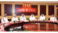 Chairman of the Board of Directors of QIIB, Sheikh Dr. Khalid bin Thani bin Abdullah Al Thani; CEO of QIIB, Dr. Abdulbasit Ahmad Al Shaibei with other officials during the Ordinary and Extraordinary General Assembly Meeting, yesterday.
