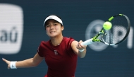 Alexandra Eala of the Philippines returns a shot against Iga Swiatek of Poland during their matchon Day 9 of the Miami Open at Hard Rock Stadium on March 26, 2025 in Miami Gardens, (Photo by AL BELLO / GETTY IMAGES NORTH AMERICA / Getty Images via AFP)
