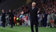 Real Madrid's Italian coach Carlo Ancelotti gestures during the UEFA Champions League Round of 16 second leg football match between Club Atletico de Madrid and Real Madrid CF at the Metropolitano stadium in Madrid on March 12, 2025. (Photo by Thomas Coex / AFP)