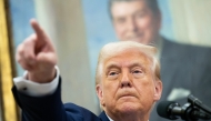 US President Donald Trump speaks during a swearing in ceremony for Alina Habba as US Attorney General for New Jersey, in the Oval Office of the White House in Washington, DC, on March 28, 2025. Photo by SAUL LOEB / AFP.