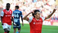 Reims' Japanese forward #17 Keito Nakamura celebrates after scoring the opening goal during the French L1 football match between Stade de Reims and Olympique de Marseille (OM) at Stade Auguste-Delaune in Reims, northern France on March 29, 2025. (Photo by FRANCOIS NASCIMBENI / AFP)
