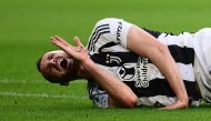 Juventus' Italian defender #04 Federico Gatti grimaces during the Italian Serie A football match between Juventus and Genoa at the Allianz Stadium in Turin, on March 29, 2025. (Photo by MARCO BERTORELLO / AFP)
