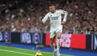 Real Madrid's French forward #09 Kylian Mbappe runs with the ball at the Santiago Bernabeu stadium in Madrid on March 29, 2025. (Photo by Thomas Coex / AFP)