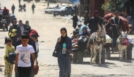 People fleeing Rafah arrive in Khan Yunis city following new Israeli evacuation orders, in the southern Gaza Strip, on March 31, 2025. Photo by Eyad BABA / AFP