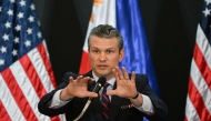 US Secretary of Defense Pete Hegseth gestures during a joint press conference with Philippines' Secretary of National Defense Gilberto Teodoro after their meeting at Camp Aguinaldo in Manila on March 28, 2025. (Photo by Ted Aljibe / AFP)